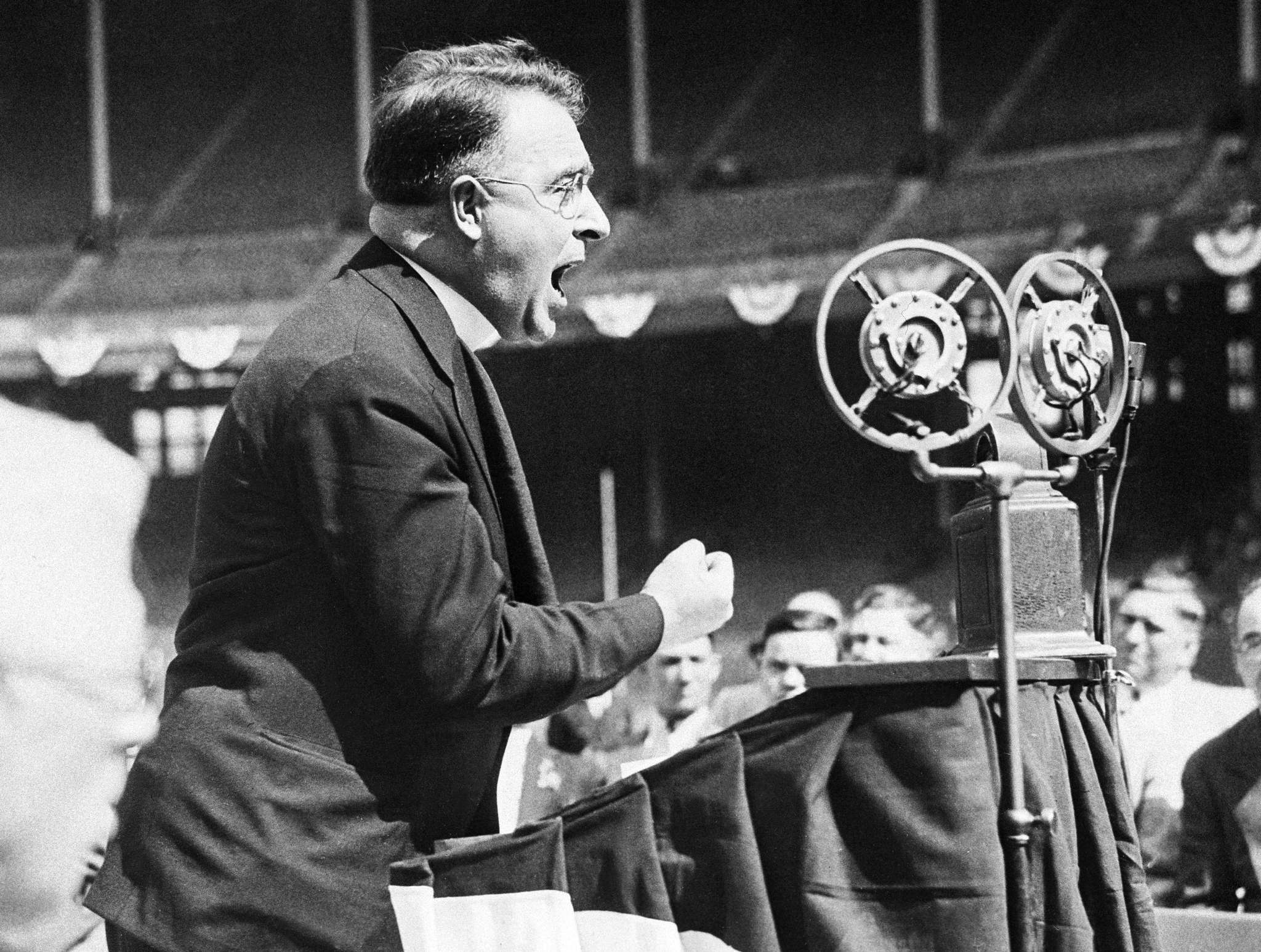 The Rev. Charles E. Coughlin of Detroit, Mich., is shown as he addressed a mass meeting of his followers in Cleveland, Ohio, May 11, 1936. He pleaded fro the support of the N.U.S.J. candidates in Tuesday's Ohio primary. (AP Photo)