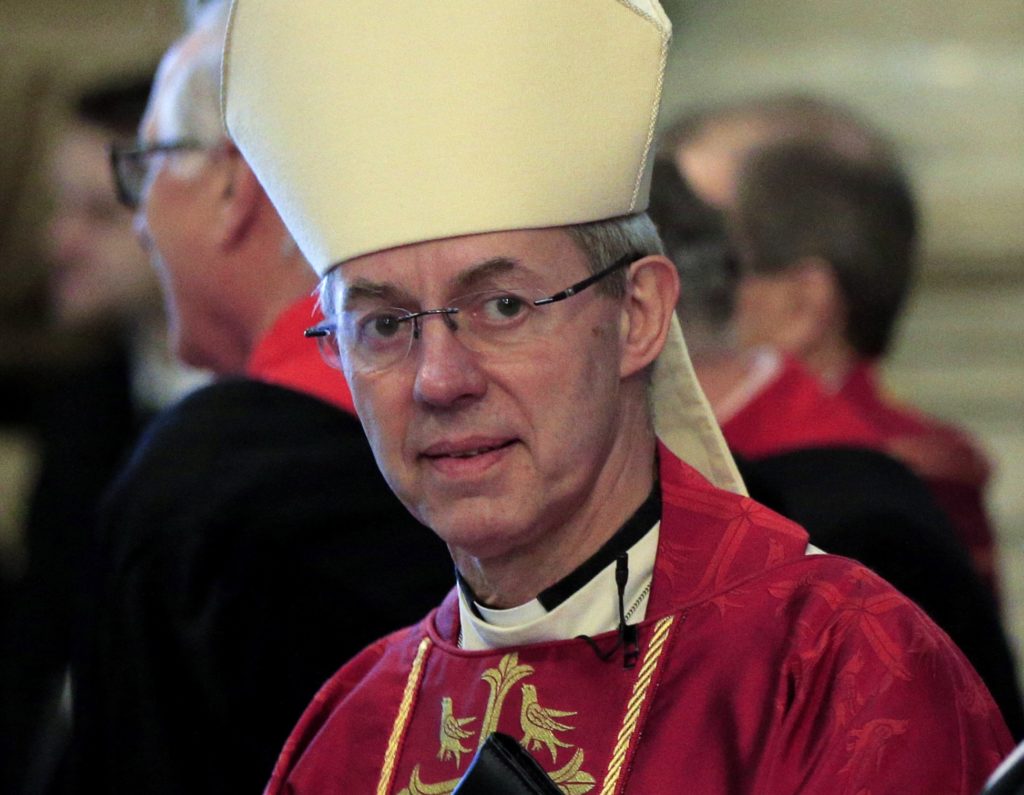 (FILES) This file photo taken on November 24, 2015 shows The Archbishop of Caterbury, Justin Welby, awaiting the arrival of Britain's Queen Elizabeth II ahead of a service at Westminster Abbey in central London. The Archbishop of Canterbury Justin Welby has confirmed that he is the illegitimate son of a one-time private secretary to Winston Churchill, after a newspaper reported the discovery late on April 8, 2016. / AFP PHOTO / POOL / JONATHAN BRADY